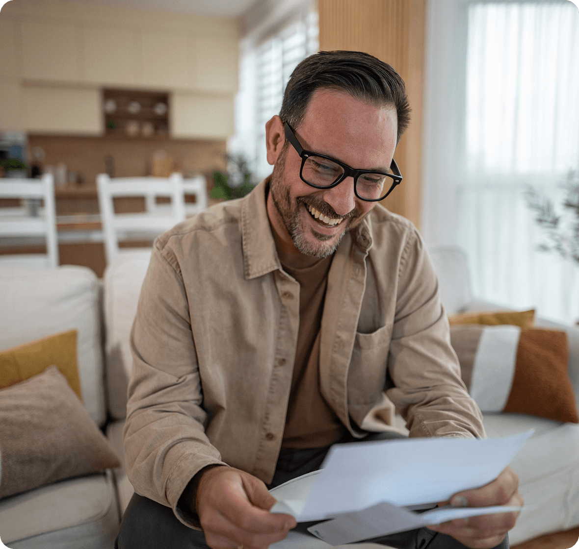 Person enjoying reading mail at home